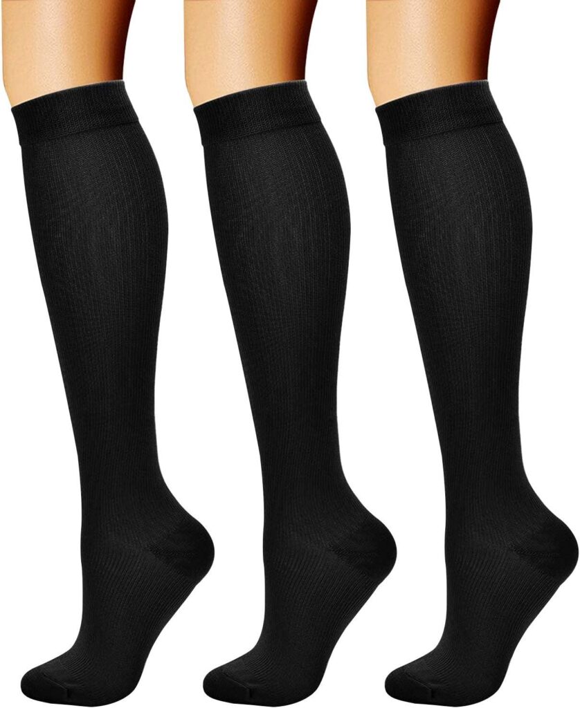 Black compression socks for long-haul flights - travel essentials for circulation and comfort. 
