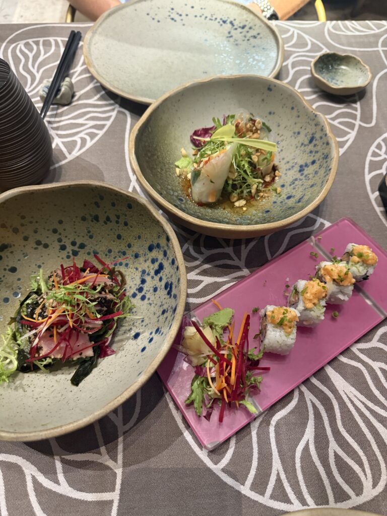 Artisan plated dishes with sushi and seafood - upscale restaurant dining for romantic getaways