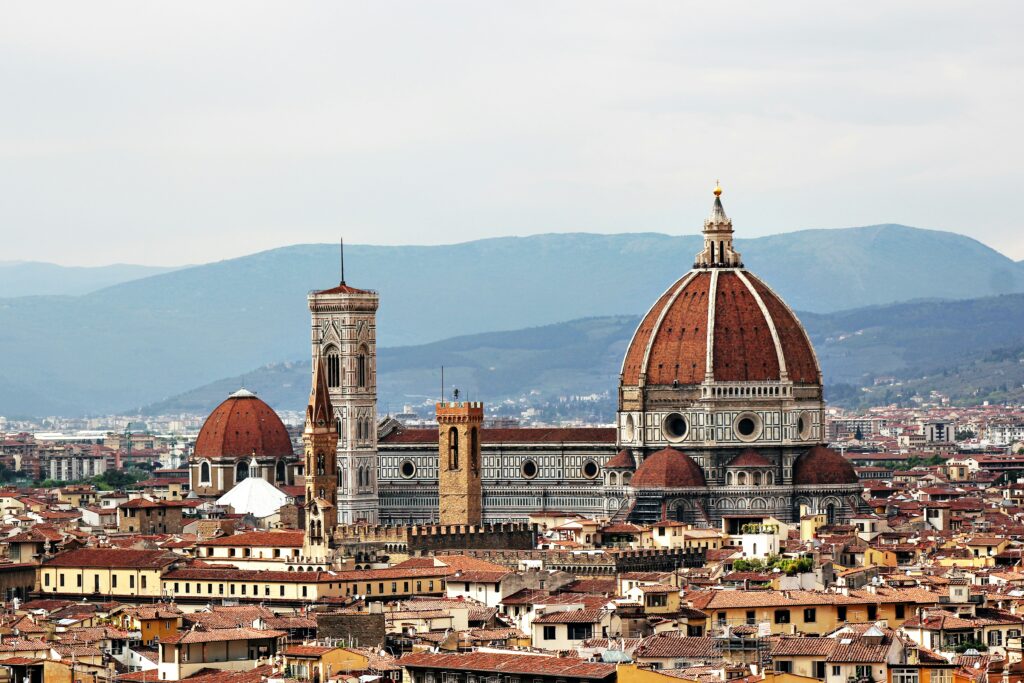 Florence Cathedral Duomo with Brunelleschi dome and Giotto bell tower dominating Tuscan cityscape - iconic Renaissance architecture and Florence Italy skyline for luxury cultural travel and autumn winter Italy vacation planning