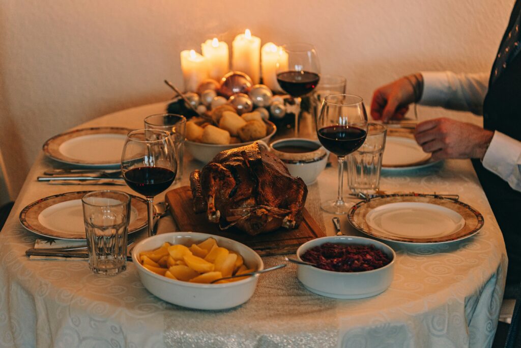 Roasted Thanksgiving turkey with cranberry sauce, sweet potatoes and holiday sides - complete turkey dinner for wine pairing recommendations