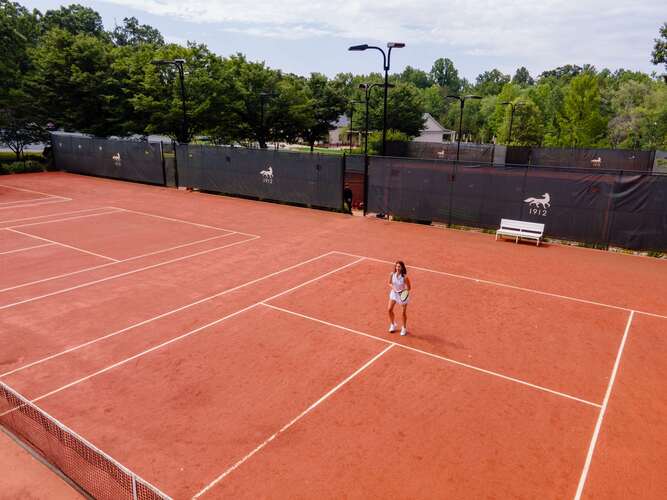 Clay tennis courts at Keswick Hall luxury resort in Charlottesville Virginia for active guests