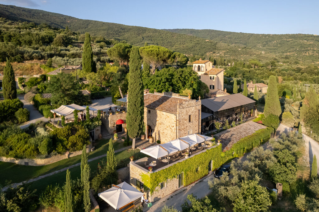 Aerial view of Baracchi Winery and vineyard estate in Cortona Tuscany surrounded by olive groves and rolling hills