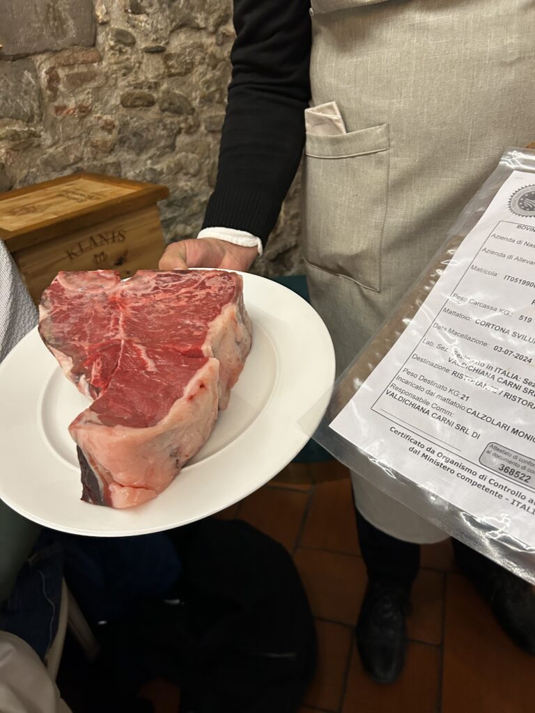 Raw bistecca alla Fiorentina steak prepared for grilling in Tuscany Italy