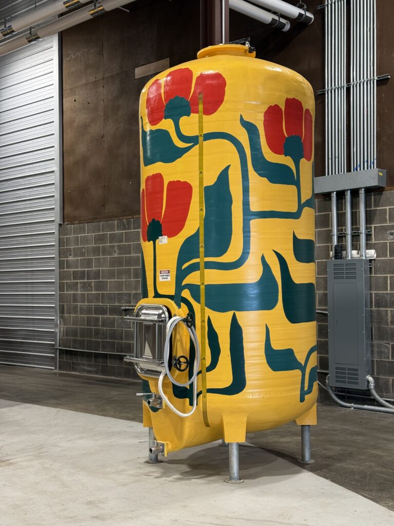 Painted fermentation tank inside Common Wealth Crush winery production facility in Shenandoah Valley Virginia