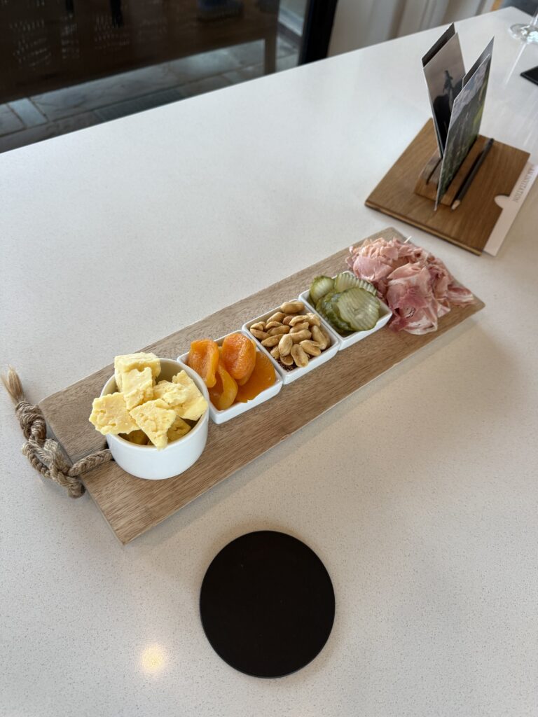 Cheese, dried apricots, peanuts, pickles, and cured ham served during a tasting at Lost Mountain Vineyards.