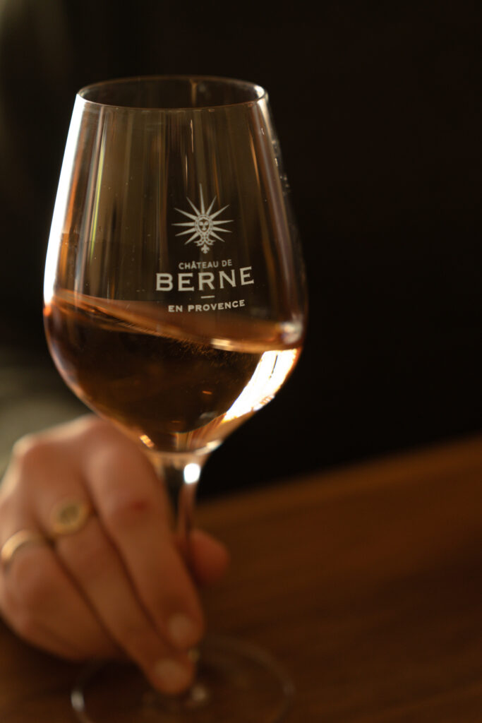 Glass of rosé wine from Château de Berne in Provence during a wine tasting experience