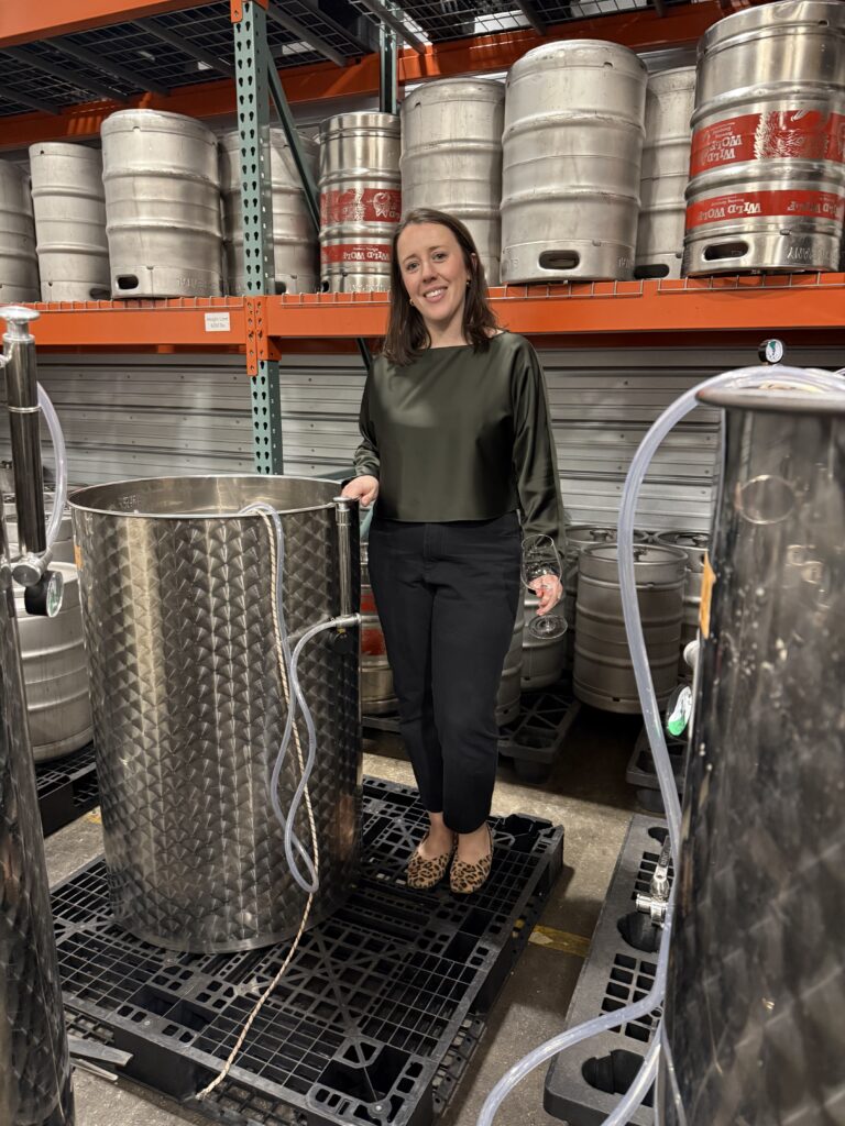 Standing beside a small stainless steel fermentation tank used for small-batch winemaking at Common Wealth Crush in the Shenandoah Valley