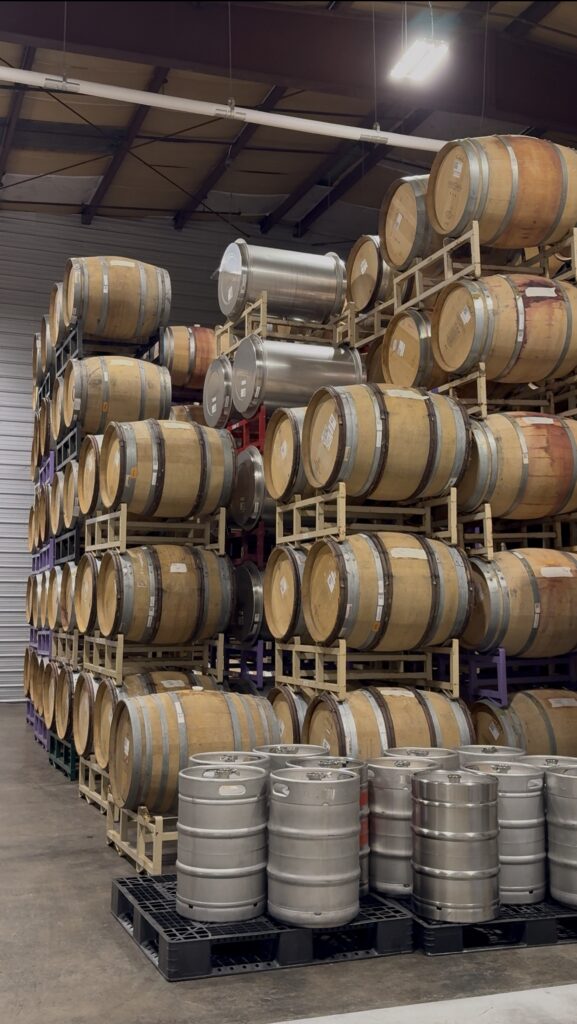 Stacks of wine barrels inside Common Wealth Crush winery in the Shenandoah Valley